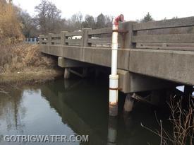 The suction pipe is attached to the bridge using a very solid, steel bracket.