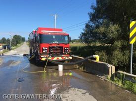 Engine 683 drafts and flow tests the new installation on Donation Road.