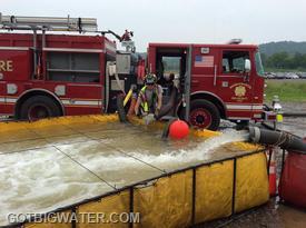 The dump site pumper was able to use multiple suction lines in order to support a peak flow of 1663 gpm and supply three jet siphon water transfer devices.