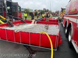Dump site operations underway using multiple suction lines.